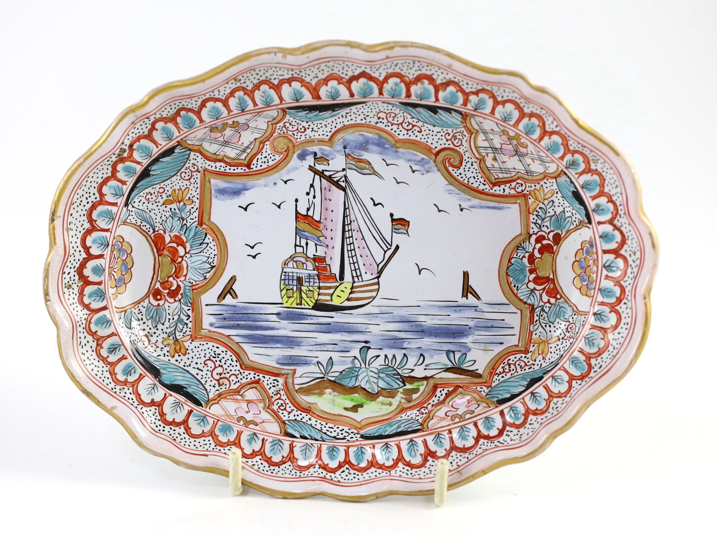 A Delft butter tub, cover and stand, Hendrik van Hoorn manufactory, second half 18th century, 18cm wide, crack to tub